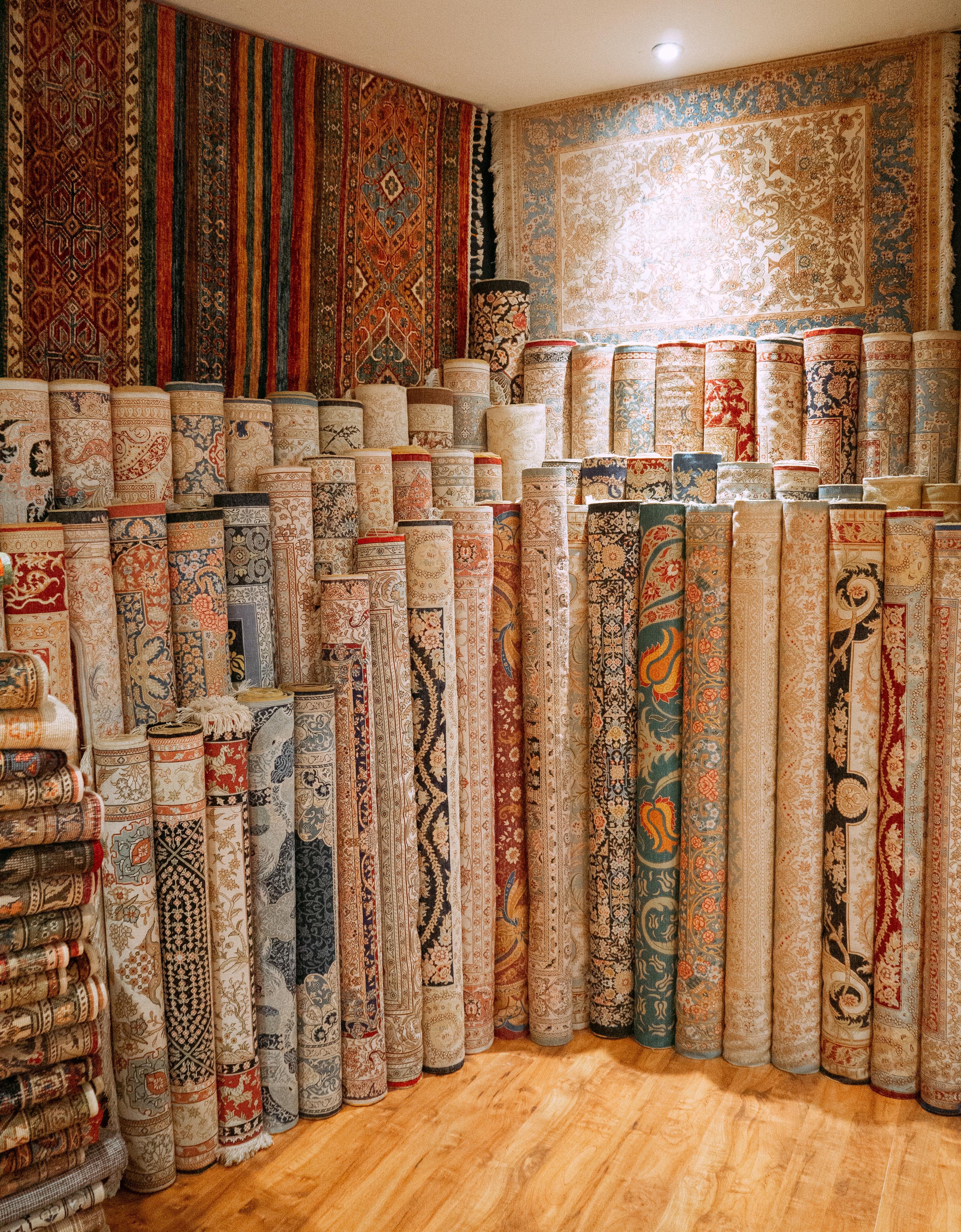 Floor Accents — rolled rugs and carpets in a showroom