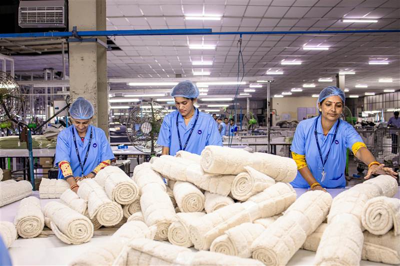 Order Management — Indian factory workers organizing and managing product orders on production line